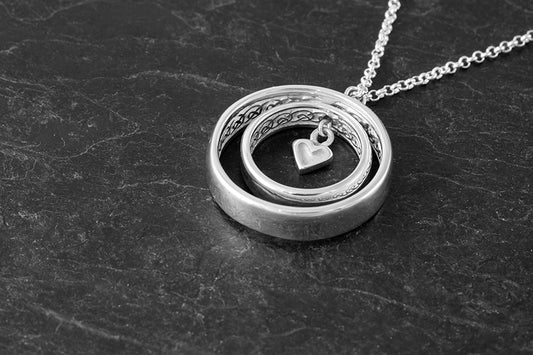 Spinning knot work rings