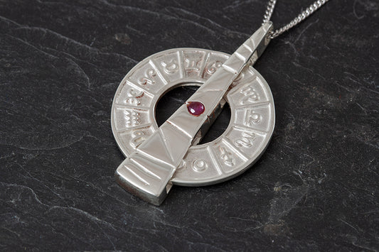 Spinning Sundial Pendant -July Birthstone Ruby